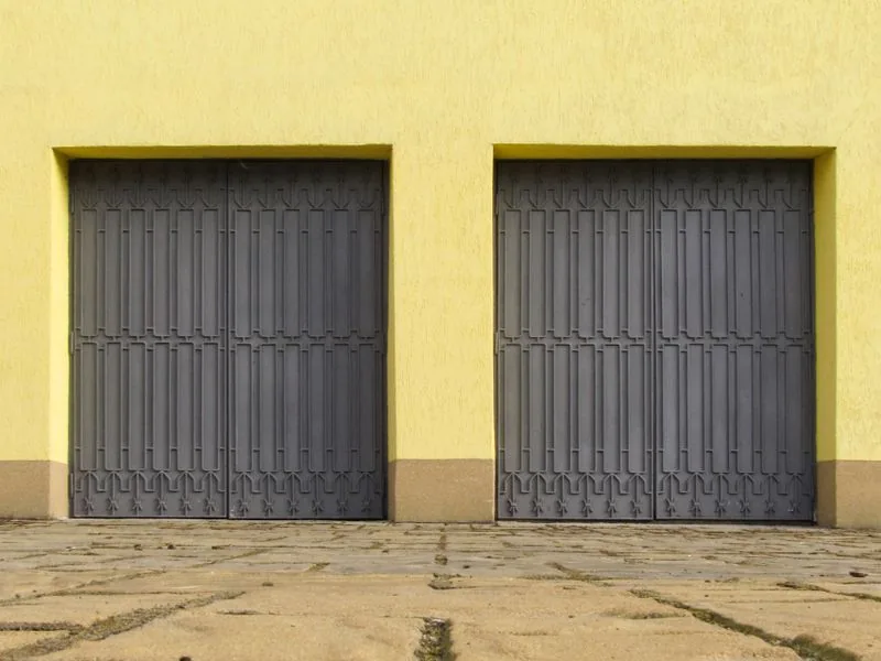 Illustration showing a dented garage-door panel